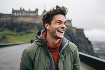 Lifestyle portrait photography of a grinning man in his 20s that is smiling with friends at the Edinburgh Castle in Edinburgh Scotland . Generative AI