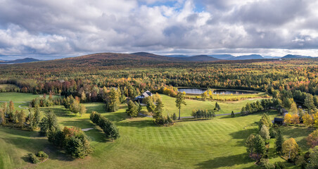 Wall Mural - Morning light showing brilliant autumn colors on the Greenville Country Club - Moosehead Lake - Maine