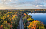 Fototapeta Na ścianę - Autumn colors at Moosehead Lake - Maine - train tracks along the shoreline