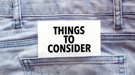 Text things to consider on a white paper stuck out from jeans pocket. Business concept