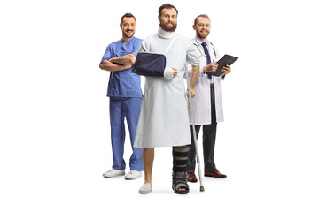 Poster - Team of doctors and a male patient with an orthopedic boot and cervical collar in a hospital gown