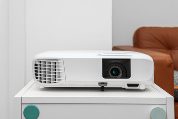 Wall Mural - White video projector on table in room, closeup