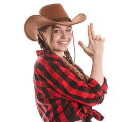 Wall Mural - Young cowgirl showing gun gesture on white background