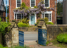 Old Brick Georgian Home With Wisteria Opposite Church Gates In Ellesmere Shropshire