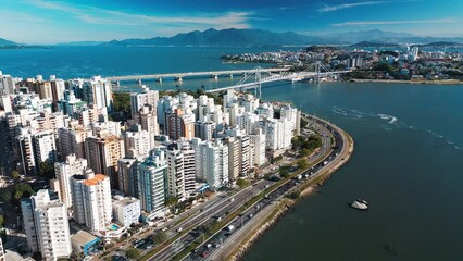 Wall Mural - Aerial view of the city of Florianopolis and its coastal highway during sunny day. Santa Catarina state in Brazil