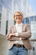 © Miljan Živković - Portrait of one caucasian blonde mature businesswoman stand outdoor