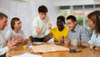 © JackF - Group of active men play board games during a friendly meeting