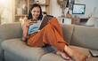 © Courtney Haas/peopleimages.com - Woman on sofa with tablet, credit card and online shopping of fintech payment on ecommerce at home. Happy female customer in apartment, bank app or sale on store website with digital internet banking
