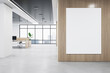 Front view of blank white isolated poster on a wooden wall at the entrance to the modern office interior with concrete floor and window with city view. 3D Rendering, mockup, template background