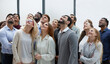 © Katsiaryna - Active multiethnic male and female audience looking up