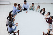© Katsiaryna - young group of businesspeople in team meeting