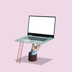 The hand holds a laptop with a white screen. Art collage. Mockup.