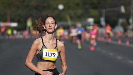 Wall Mural - Female runner jog sport marathon. Woman athlete running long distance. Girl jogger work out urban public park. Sportswoman train body. Health city life concept. Fast race slow motion. Active fit track