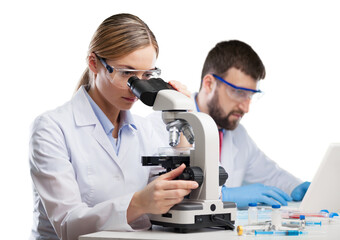 Wall Mural - Young woman medical researcher looking through a modern microscope in a laboratory