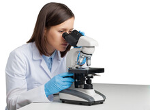 Young Woman Medical Researcher Looking Through A Modern Microscope In A Laboratory