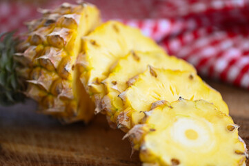 Wall Mural - pineapple slice on plate for food fruit ripe pineapple on wooden background, fresh pineapple tropical fruits summer