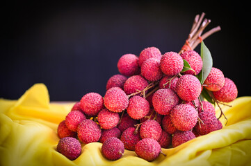 Wall Mural - fresh ripe lychee fruit tropical fruit peeled lychees slice in Thailand, lychees on table and black background