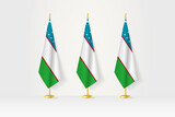 Fototapeta Boho - Three Uzbekistan flags in a row on a golden stand, illustration of press conference and other meetings.
