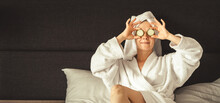 Young Woman Getting Eye Nature Treatment By Cucumber At Luxury Spa Resort. Wellness And Healing Concept.