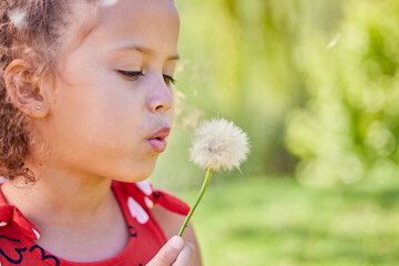 Poster - Spring, dandelion and relax with child in park for freedom, youth and growth with mockup space. Nature, summer and flowers with young girl and plant in outdoors for wish, good luck and dream