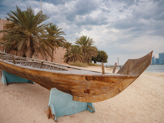 Wall Mural - Wooden boat at Heritage Village, United Arab Emirates. It is a popular tourist attraction showing life in Abu Dhabi before the oil boom.