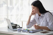 © PHAISITSAWAN - Concept Burnout Syndrome. Asian business Woman feels uncomfortable working. Which is caused by stress, accumulated from unsuccessful work And less resting body. Consult a specialist psychiatrist.