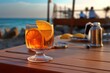 © Marat - Refreshing Orange cocktail by the sea. Oranges. Summer, beach and vacation.