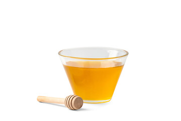 Wall Mural - Honey in a bowl with a wooden dipper on a white isolated background.