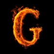 © ITrWorks - Fire font text letter G on black background, generative ai generated
