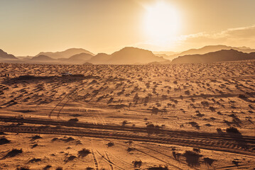 Canvas Print - Sun over Um Sabatah area of Wadi Rum valley in Jordan