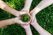Environment Earth Day In the top view the hands holding green earth. care, saving and energy are renewable and the environment is sustainable. Save Earth. Concept of the Environment World Earth Day.