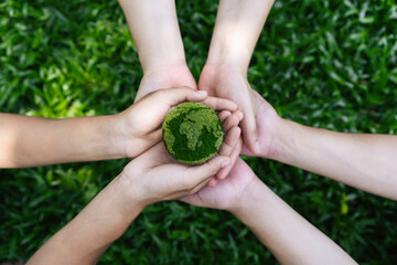 environment earth day in the top view the hands holding green earth. care, saving and energy are ren