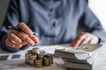 Wall Mural - Woman calculating monthly expenses, taxes and interest calculate at home.