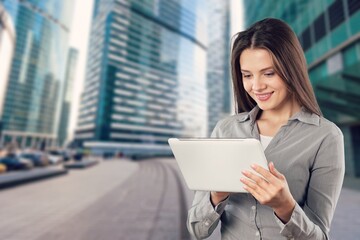 Portrait of a successful young business woman hold digital tablet