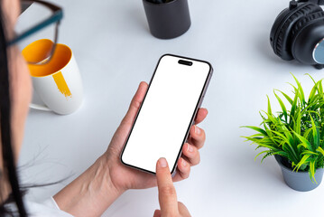 Aufkleber - Woman touch smart phone with isolated display for mockup fort app or od web page presentation. Office desk in background