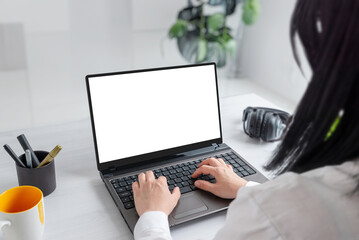 Aufkleber - Girl immersed in her tasks on a laptop with an isolated screen for mockup. Professional office desk composition