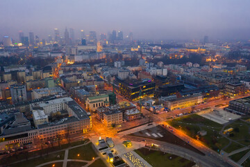 Wall Mural - Aerial view of illuminated cityscape of Warsaw at spring twilight, Poland..