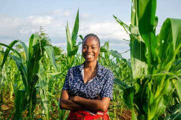 portrait of an excited and happy female african farmer