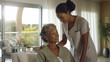© wetzkaz - gentle trained nurse helping mature patient in modern indoor nursing home or retirement home or hospital or health resort, fictional place