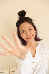 Wall Mural - Happy teen girl 11-15 year old. Portrait beautiful woman smiling with perfect smile and white teeth. asian lady girl wear casual cloth with smiling looking at camera. White background.