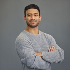 Wall Mural - portrait of happy man with mockup, arms crossed and ideas on studio backdrop in casual fashion. rela