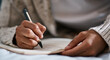 © Felix/peopleimages.com - Notebook, bed and person hands for planning, brainstorming and studying notes, education and creativity. Journal, goals and student in bedroom zoom for home learning, plan schedule and reminder