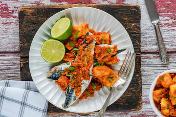 Wall Mural - Fried mackerel with spicy sauce and bomay potatoes