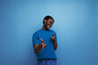 © Ivan Traimak - authentic ethnic african young man with dreadlocks in a casual t-shirt on a background with copy space