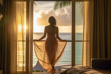 Rear View Of A Woman Standing At The Window Of Her Hotel Room, Gently Pulling Open The Curtains To Embrace The Soft Morning Sunlight.