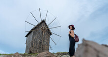 "In Front Of The Windmill, A Teenage Girl, A Skilled Photographer, Captures The Rustic Charm. Her Nostalgic Smile Speaks Of Tradition And Harvest, Evoking Memories Of A Bygone Era