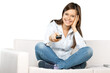 © BillionPhotos.com - Smiling Woman Using Remote Control