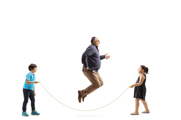 Poster - Full length profile shot of mature man skipping a rope with children