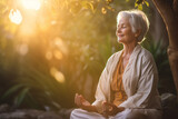 Fototapeta  - An elderly woman enjoying a peaceful meditation session in a tranquil garden, elderly happy people, old age, bokeh Generative AI