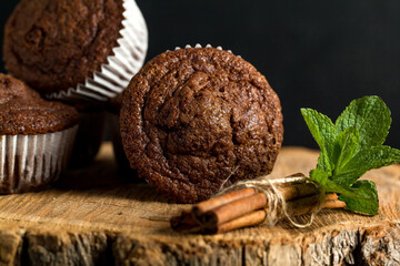 Wall Mural - Chocolate cupcakes. Freshly baked muffins with fresh berries